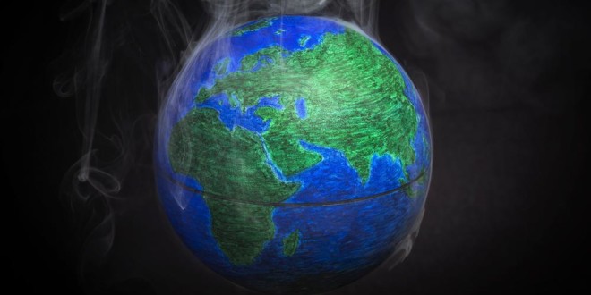 A picture taken on November 10, 2015 shows a small globe surrounded by smoke to illustrate global warming. France will be hosting and presiding the 21st Session of the Conference of the Parties to the United Nations Framework Convention on Climate Change (COP21/CMP11), also known as Paris 2015 from November 30 to December 11. AFP PHOTO / LIONEL BONAVENTURE        (Photo credit should read LIONEL BONAVENTURE/AFP/Getty Images)