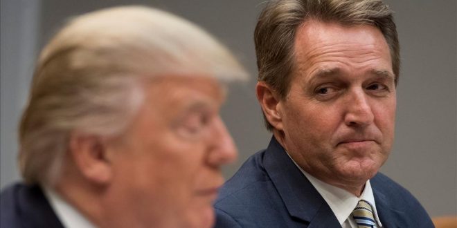 FILES  This file photo taken on December 5  2017 shows US President Donald Trump speaks during a lunch meeting with Republican members of the Senate  including US Senator Jeff Flake  R   Republican of Arizona  in the Roosevelt Room of the White House in Washington  DC  A maverick senator from Donald Trump s own Republican party launched a stinging attack on the president on January 17  2018  accusing him of employing Stalinist language to attack and undermine the free press  Arizona lawmaker Jeff Flake levelled the broadside in an address from the Senate floor  timed to coincide with the expected announcement of controversial  Fake News Awards  by Trump s administration     AFP PHOTO   SAUL LOEB