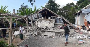 Villagers walk near destroyed homes in an area affected by the early morning earthquake at Sajang village  Sembalun  East Lombok  Indonesia  Sunday  July 29  2018  A shallow  magnitude 6 4 earthquake early Sunday killed at least 10 people and injured 40 on Indonesia s Lombok Island  a popular tourist destination next to Bali  officials said   AP Photo  Rosidin