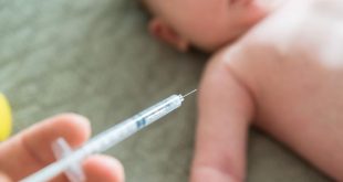 Close-up Of A Doctor Hand Vaccinating Baby