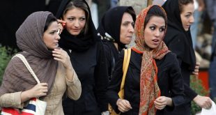Iranian women walk in a street in Tehran 23 April 2007  The police bus screeches to a halt at a Tehran square packed with traffic  The officers leap out and begin spot checks on passing pedestrians and cars  Police work apparently like any other place in the world  But here in the Iranian capital their targets are women deemed to have infringed the Islamic republic s strict dress rules  AFP PHOTO ATTA KENARE
