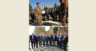 مرقص إكليلًا على تمثال بشارة الخوري