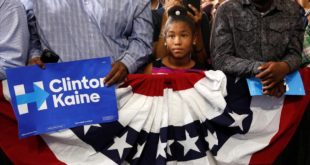A young girl listens to U S  President Barack Obama speak at a Clinton-Kaine campaign rally at Florida Memorial University in Miami   October 20  2016    REUTERS Kevin Lamarque
